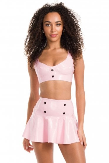 Westward Bound Cirque-Etiquette Popper-Detail Latex Skirt in Baby Pink, front three-quarter view showing the high waist, front popper detail and flared hem