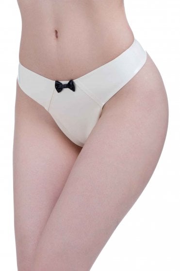 Westward Bound Lulu Bow-Detail Latex Thong in Warm White with Black Trim, front three-quarter view showing the clean low-rise silhouette and contrast Black centre bow